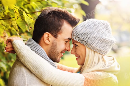 Preview: Young lovely couple in the park in autumn