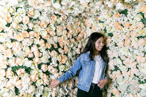 Preview: Teen girl standing in a room full of roses