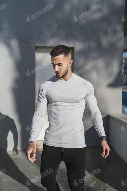 Preview: Young man in cool casual style posing outdoors