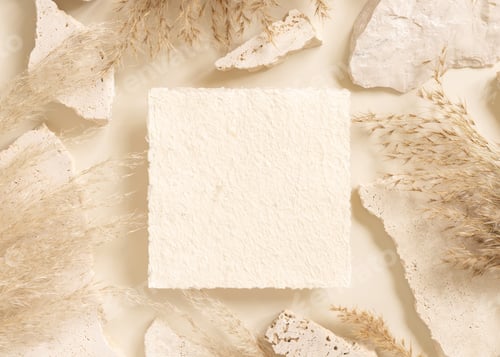 Preview: Square card near beige travertine stones and dried pampas grass top view, greeting mockup