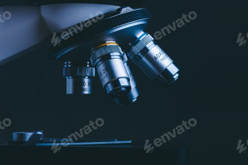 Preview: Closeup of Scientific microscope data analysis in the medical science laboratory, black background