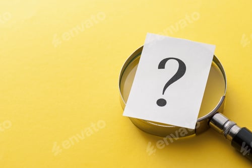 Preview: Printed question mark covering a magnifying glass