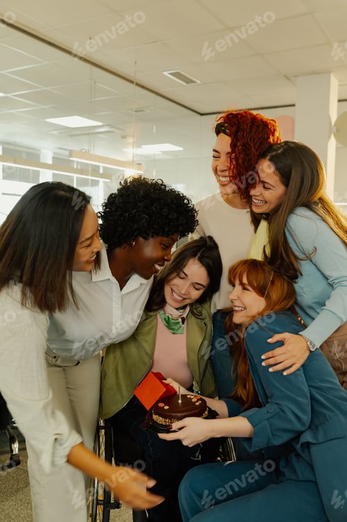 Preview: A diverse team is celebrating birthday at the office.
