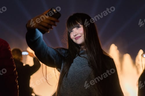 Preview: Asian young girl in the magic lights of montjuic, Barcelona