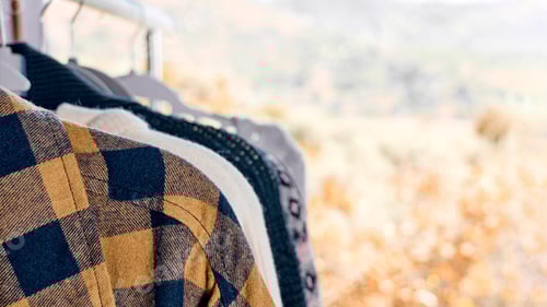 Preview: Autumn Clothes Hanging in Front of Blurred Meadow