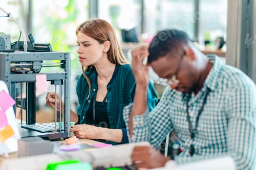 Preview: Diverse Startup Team Working on 3D Printing Project
