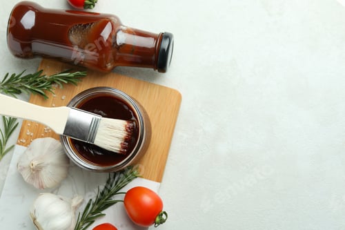 Preview: Concept of cooking with barbecue sauce on white textured table