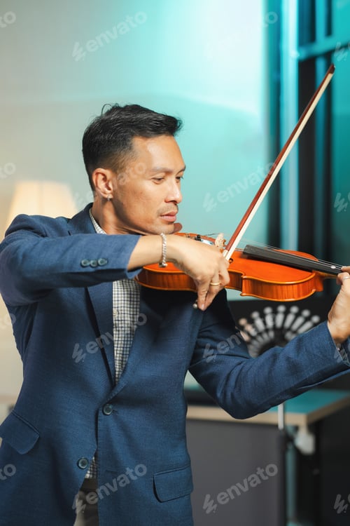 Preview: Asian Man Practicing Violin with Focus and Passion.