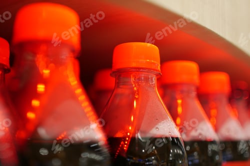 Preview: plastic bottles of soft drink on table