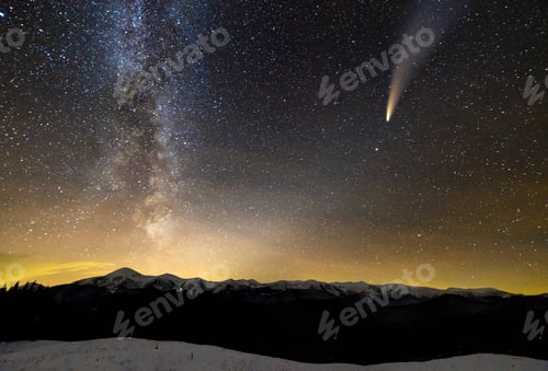 Preview: Surreal view of night in mountains with starry dark blue cloudy sky