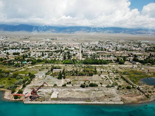 Preview: Aerial view of abandoned port with rusted quay cranes