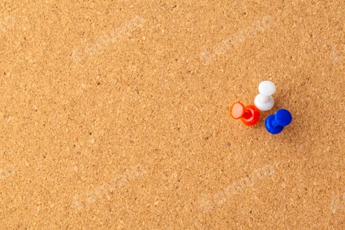 Preview: Group of thumbtacks pinned on corkboard. Creative photo