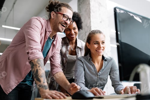 Preview: Working together on project. Happy young business colleagues working in office