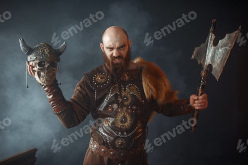 Preview: Angry viking holds enemy's skull in helmet and axe