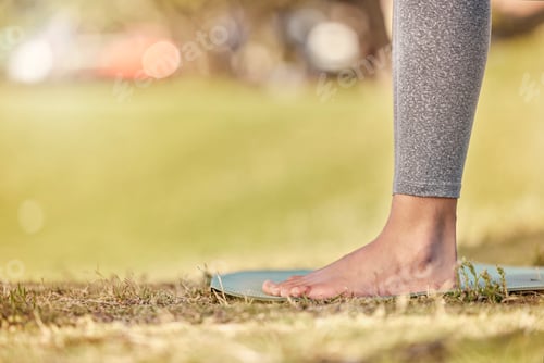 Preview: Woman feet, mat and yoga on grass, park and exercise, meditation and spiritual wellness in nature f