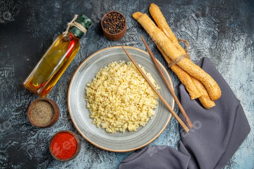 Preview: top view cooked pearl barley with seasonings on light floor meal dish dinner rice