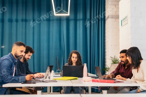 Preview: Group of people working with laptop in a coworking