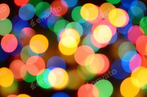 Preview: Blurred festive colorful lights over black useful as background. All main colors included