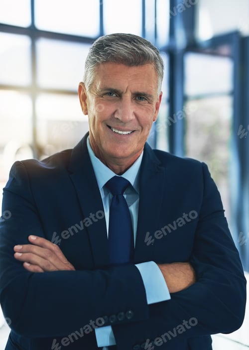 Preview: Portrait of a confident businessman posing with his arms crossed in the office