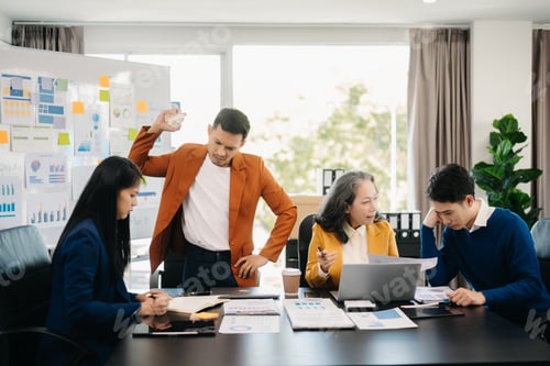Preview: Team thinking of problem solution Furious two Asian businesspeople arguing strongly after making
