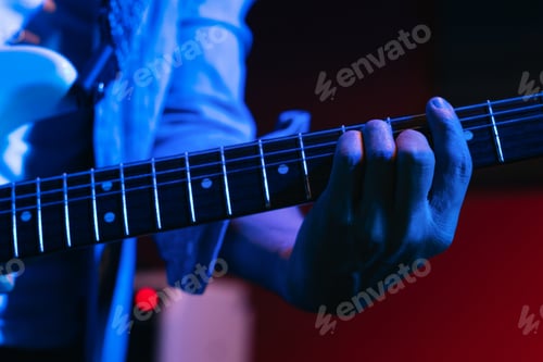 Preview: Musician Playing Electric Guitar During Live Concert