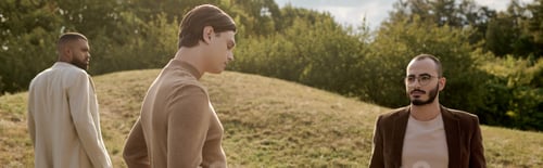 Preview: Handsome men dressed in stylish autumn attire enjoying nature in a vibrant autumn field