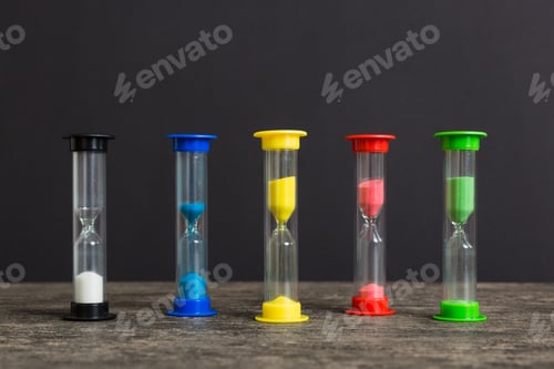 Preview: hourglass on the table, sand clock as time passing concept for business deadline, copy space
