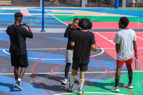 Preview: Group of young people on the basketball court talking