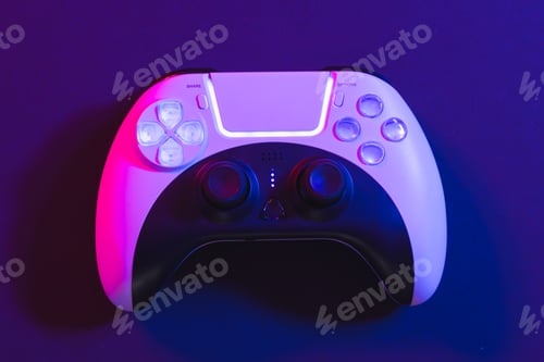 Preview: Composite of video game pad and copy space on neon background