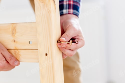 Preview: Man Assembling Bed