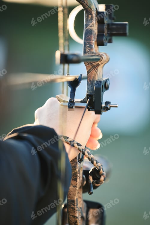 Preview: Sports archer, hands and bow and arrow training for archery competition, athlete challenge or girl