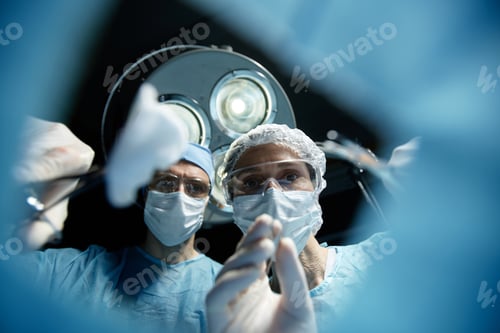 Preview: Team of Surgeons Performing Operation