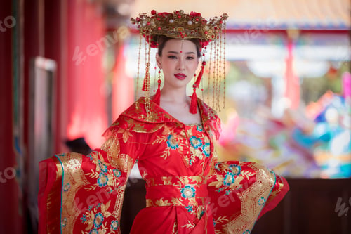 Preview: Portrait happiness young beautiful Asian woman wear red cheongsam dress costume posing happy smiling