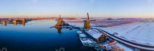 Preview: Wooden historical windmills Zaanse Schans windmill village during winter with snow