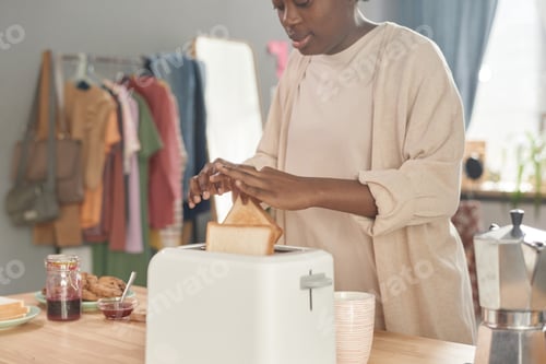 Preview: Woman making toasts in the morning
