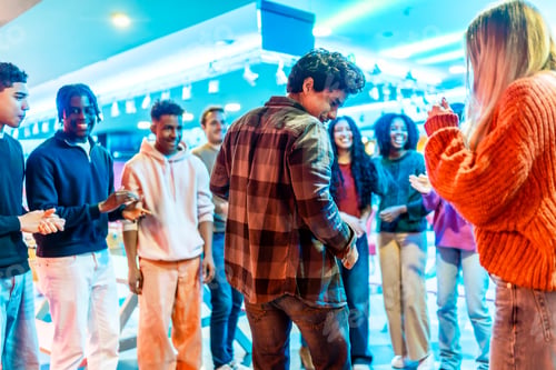 Preview: Multiethnic friends playing and having fun at the bowling alley