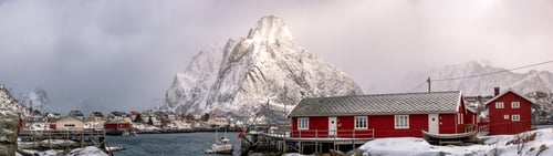 Preview: Panorama of Red house snowy with snow mountain on harbor at arctic coastline