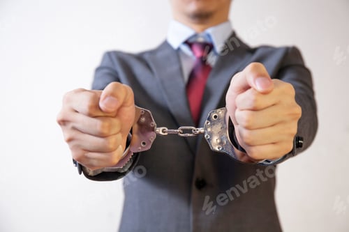 Preview: Business man criminal handcuffed