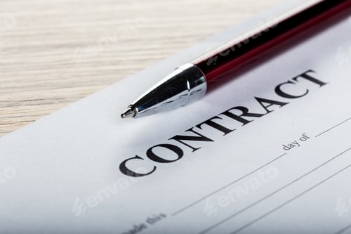 Preview: Pen and contract papers on wooden desk