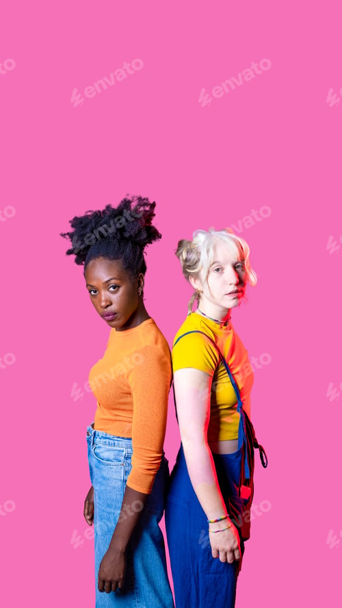 Preview: Two young diverse multicultural caucasian and black women best friends standing