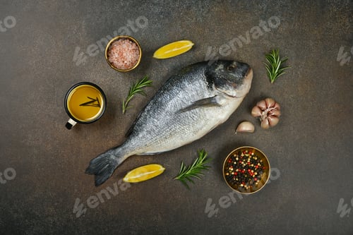 Preview: Raw Dorada sea bream fish on table