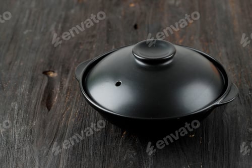 Preview: Black Nabe with Lid on Wooden Table