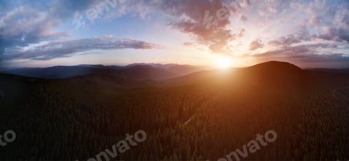 Preview: Mountain hills with trees under beautiful cloudy sky.