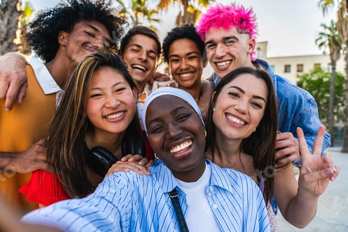 Preview: Multiethnic group of young happy friends hanging out