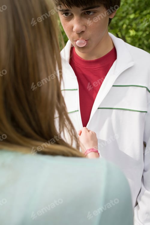 Preview: Teenage boy blowing a bubble