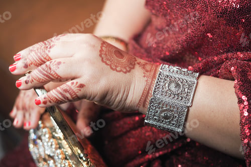 Preview: Beautiful mehndi design on hand during festive celebration