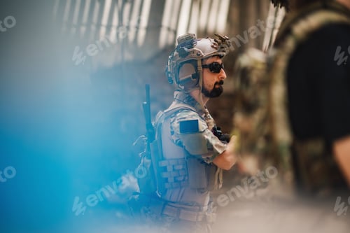 Preview: Side view of soldier with weapon in action during mission in war.