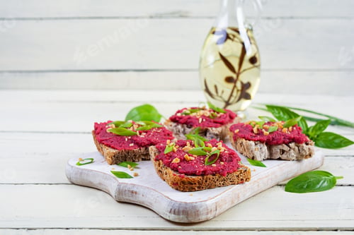 Preview: Toasts with beetroot, chopped nuts and herbs. Vegan bruschetta with beet