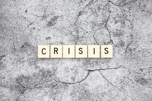 Preview: Crisis word tiles on a cracked concrete background