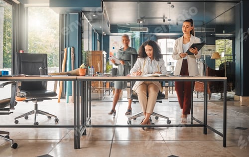 Preview: Busy days are productive days. Shot of a group of businesswomen working in an office.